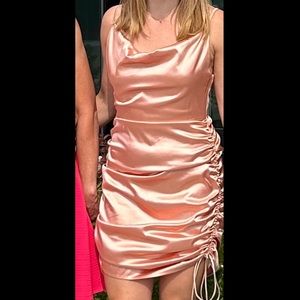 Size small (4) peach satin fancy dress, adjustable length, great condition.